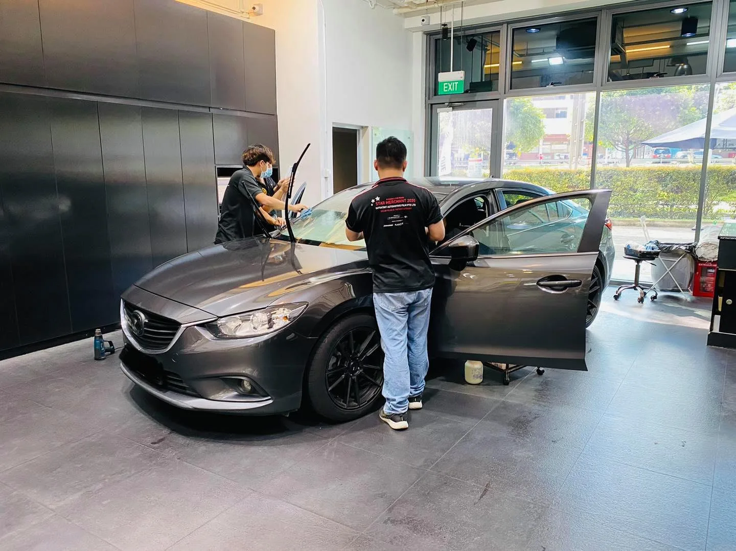 Grey Mazda 6 sedan with front windows being tinted at Infratint Singapore