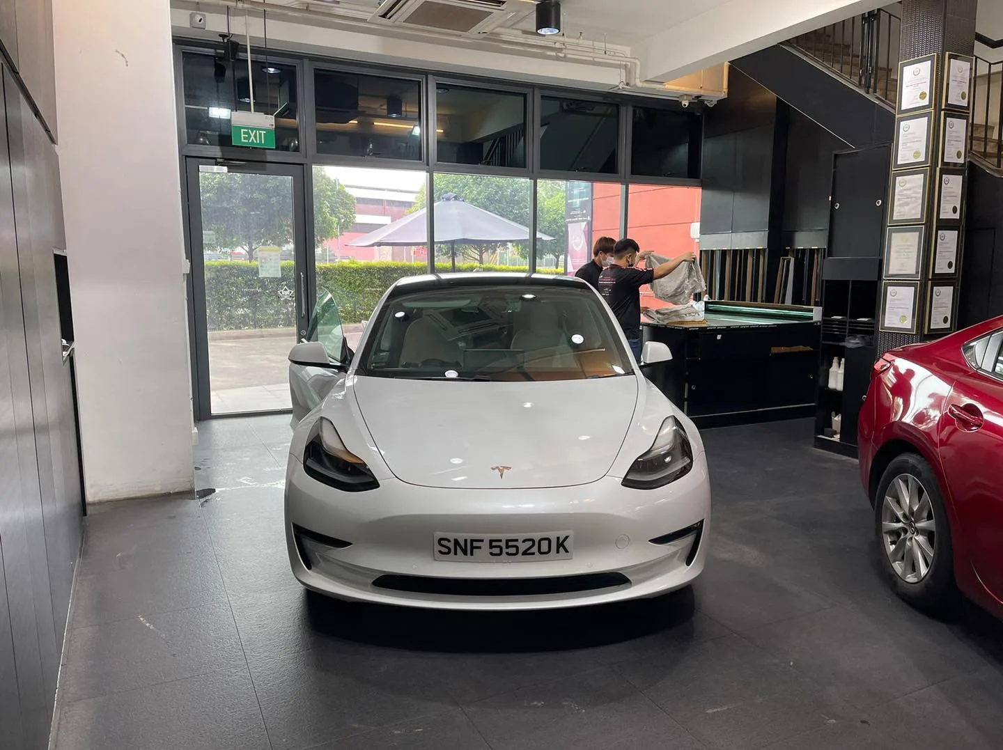 White Tesla Model 3 at Infratint Singapore for window film installation