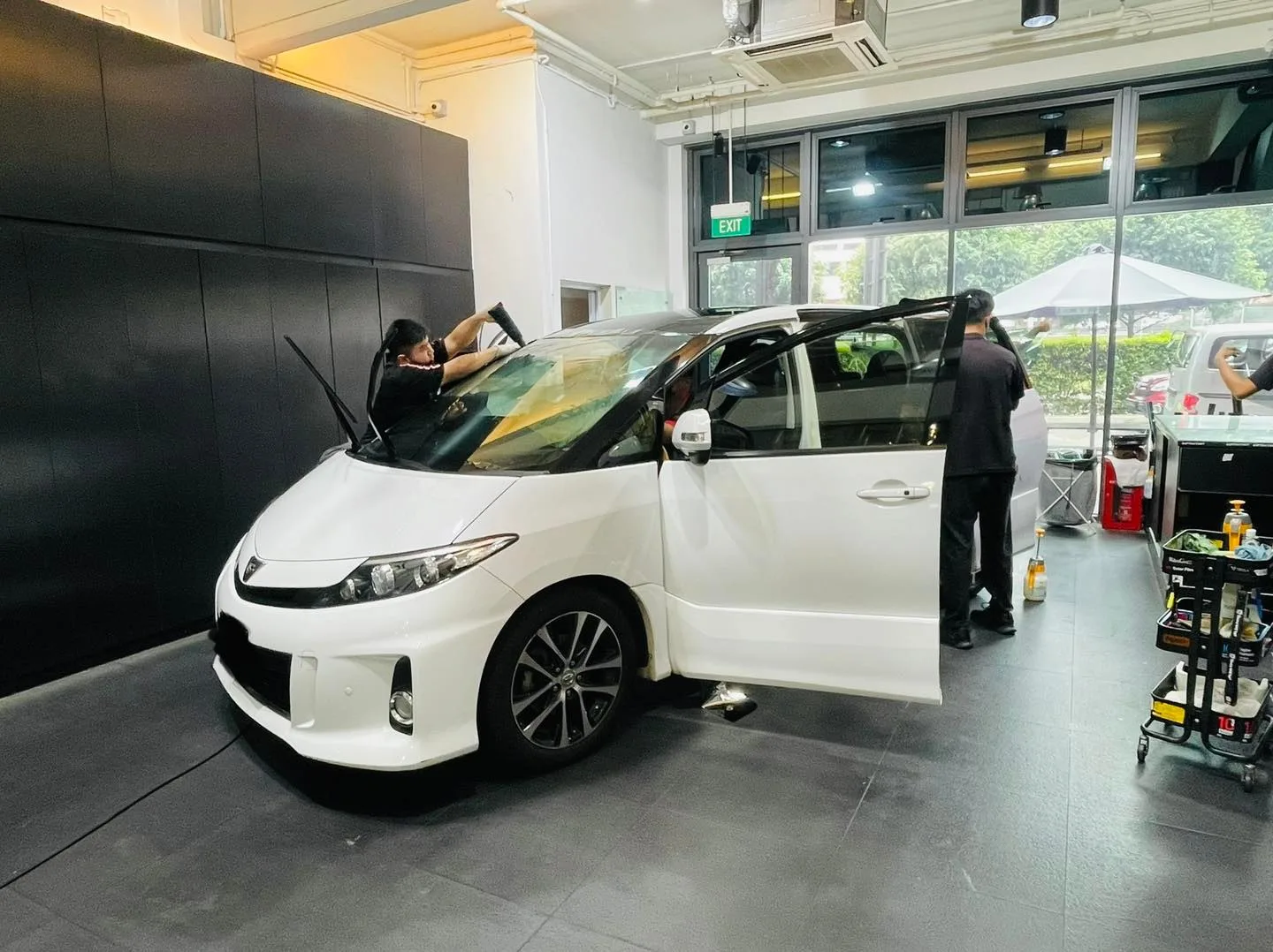 White Toyota Estima MPV having window film fitted at Infratint Singapore