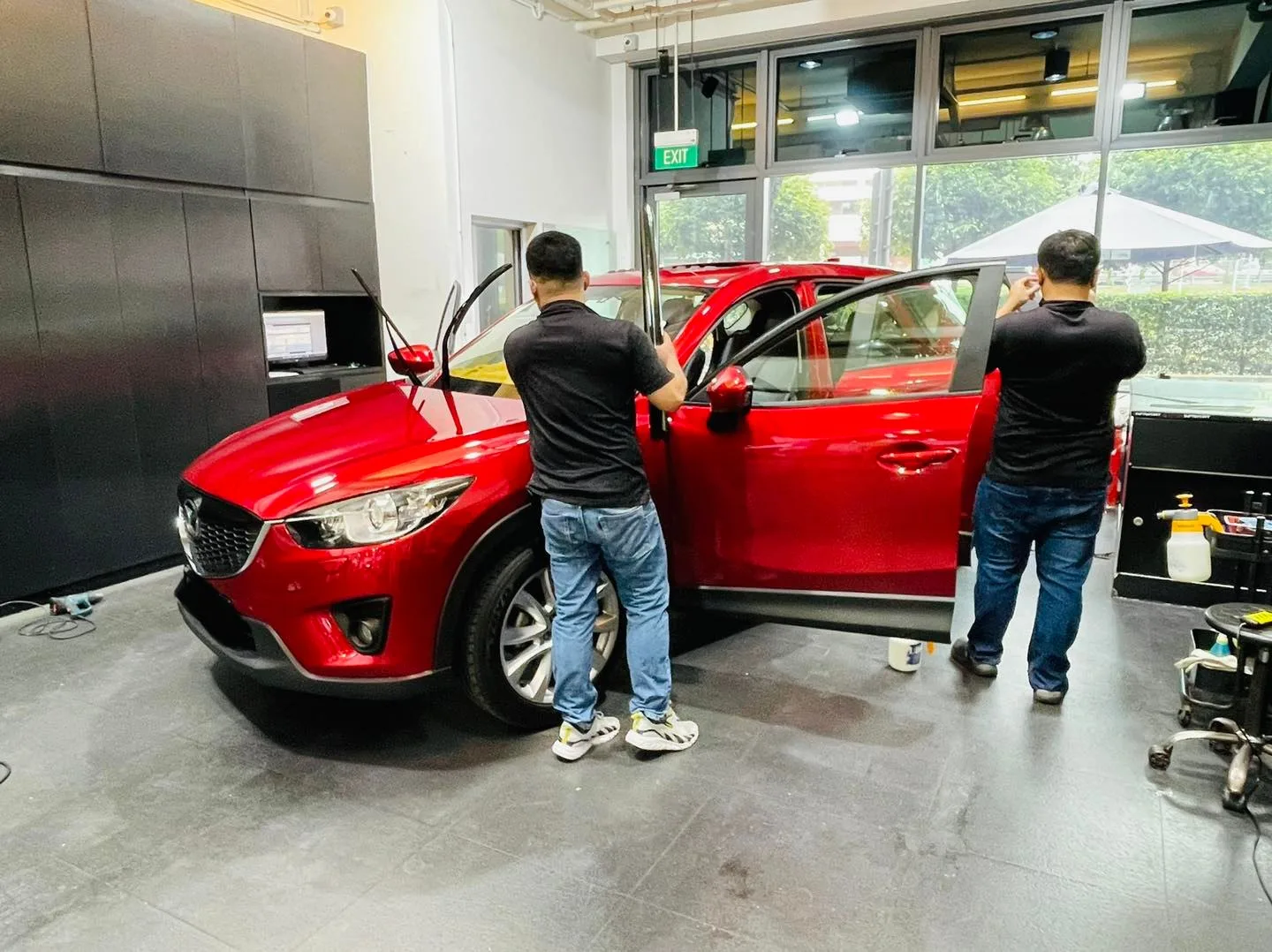 Red Mazda CX-5 SUV having its windows tinted at Infratint Singapore