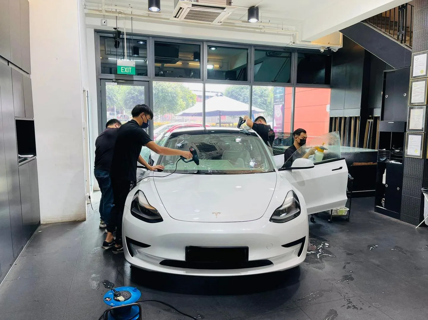 White Tesla Model 3 having windscreen film fitted at Infratint Singapore