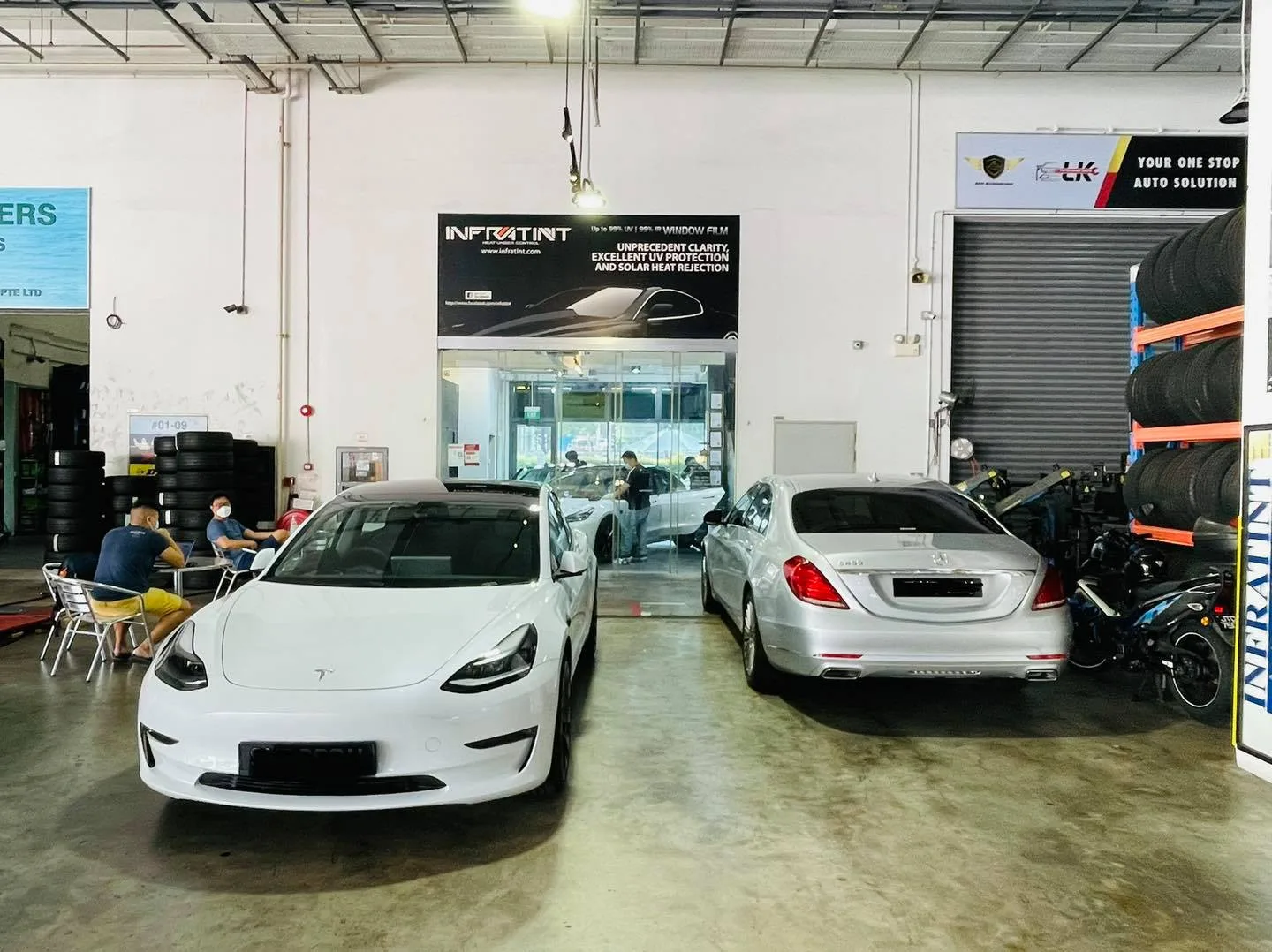 White Tesla Model 3 and silver Mercedes-Benz S-Class at Infratint Singapore for window tinting