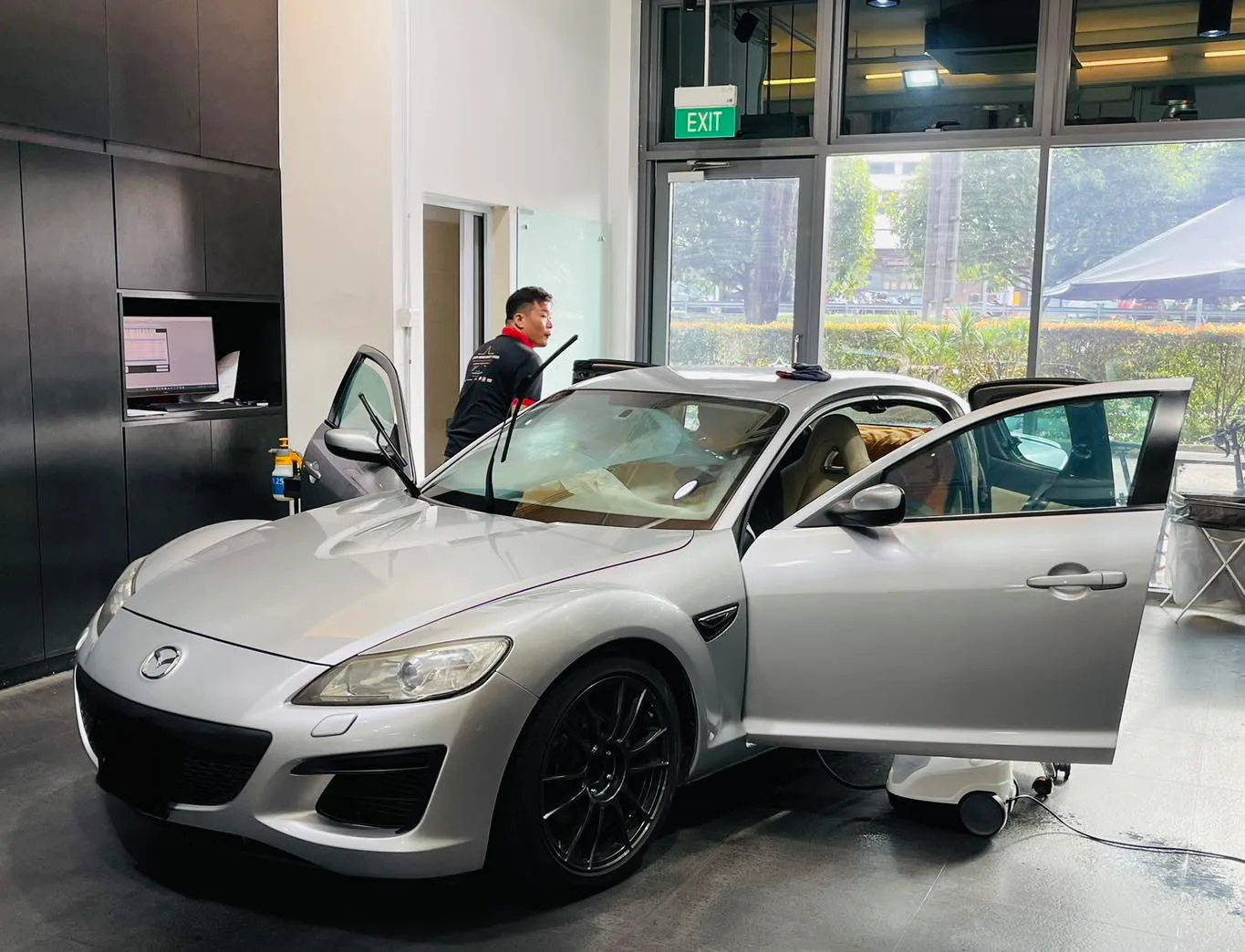 Silver Mazda RX-8 coupe being window tinted at Infratint Singapore