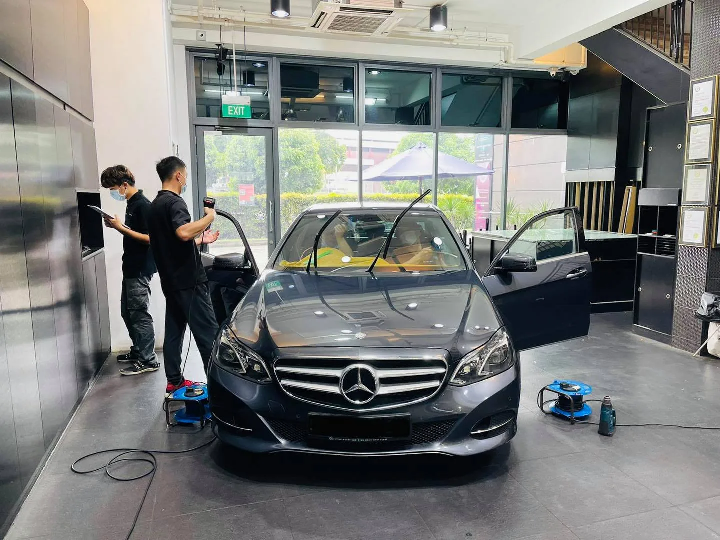 Grey Mercedes-Benz E-Class being prepared for window tinting at Infratint Singapore
