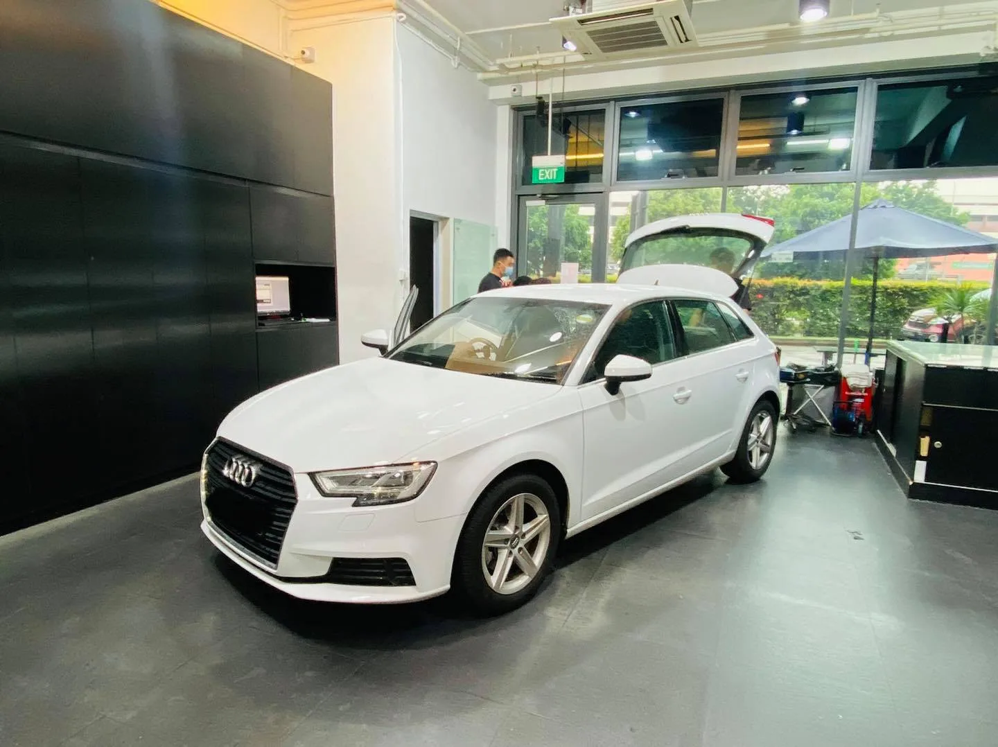 White Audi A3 Sportback inside the Infratint Singapore showroom for window tinting