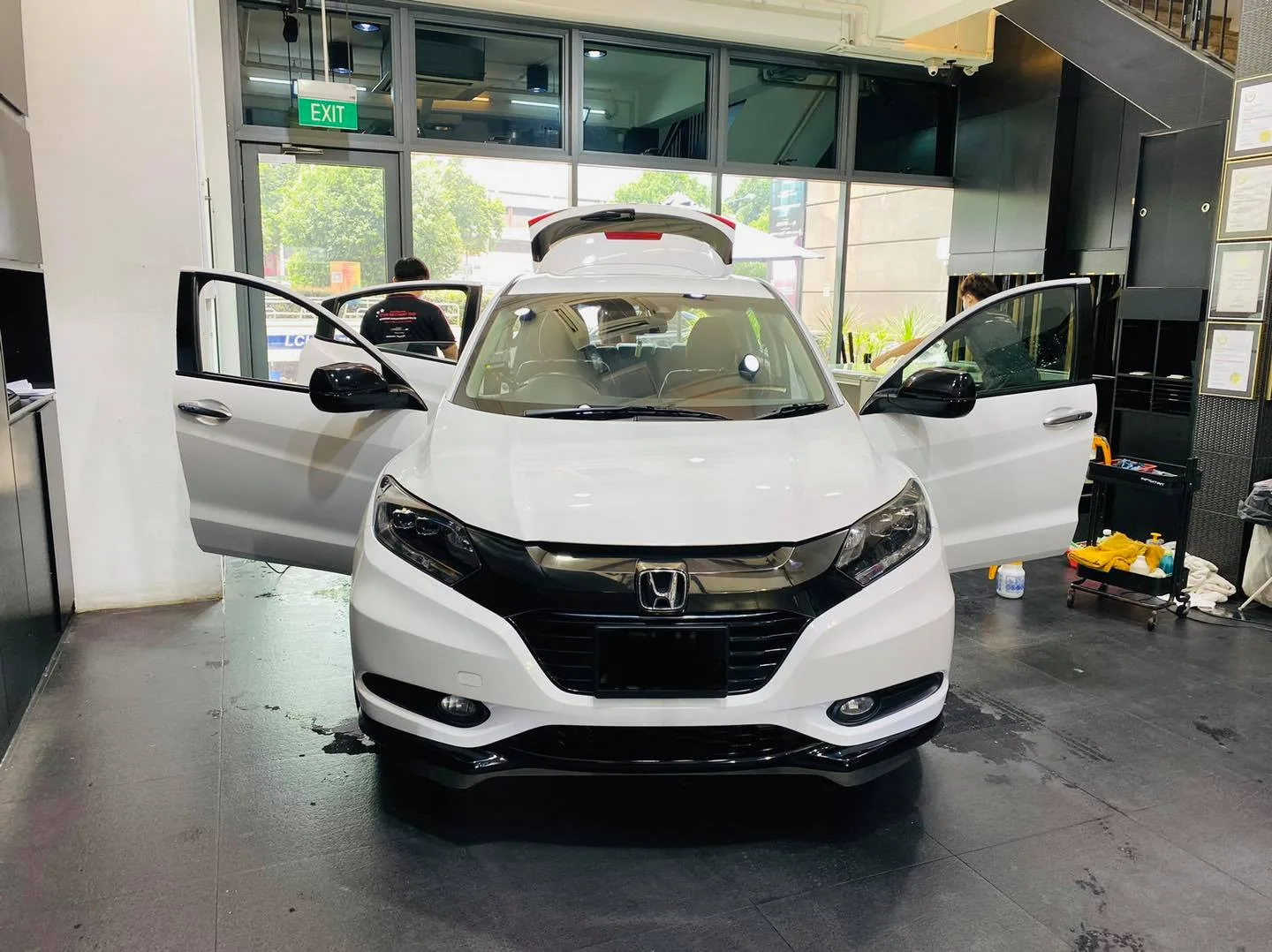 White Honda SUV with doors open for window film at Infratint Singapore