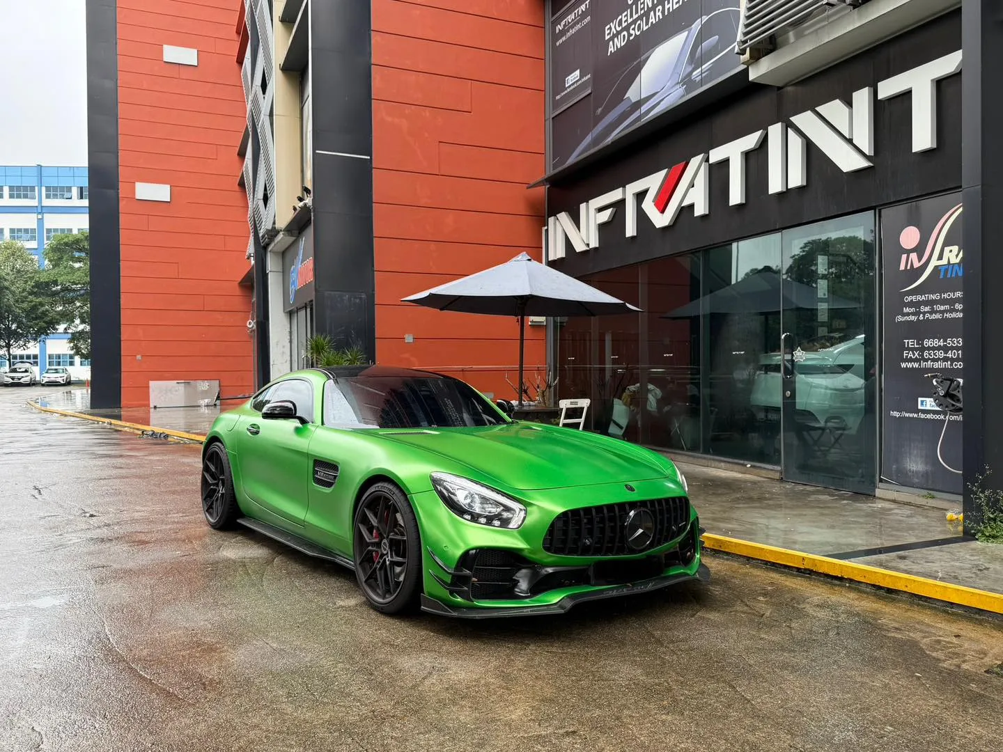 Green Mercedes-AMG GT front three-quarter view with tinted glass at Infratint Singapore