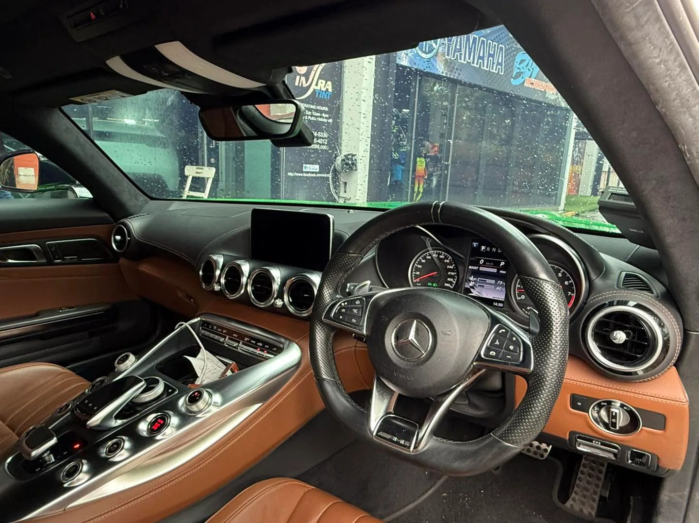 Mercedes-AMG GT interior with cognac leather seen through tinted glass at Infratint Singapore