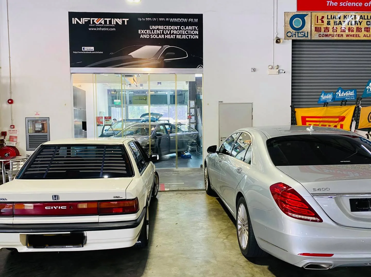 White Honda Civic and silver Mercedes-Benz S-Class from behind at Infratint Singapore