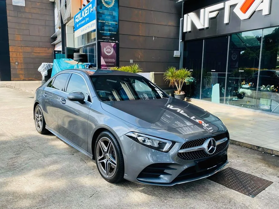 Grey Mercedes-Benz A200 AMG front three-quarter view outside Infratint Singapore