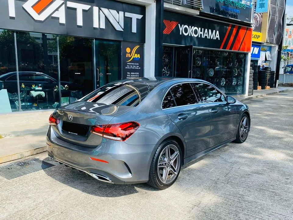Grey Mercedes-Benz A200 AMG rear three-quarter view outside Infratint Singapore
