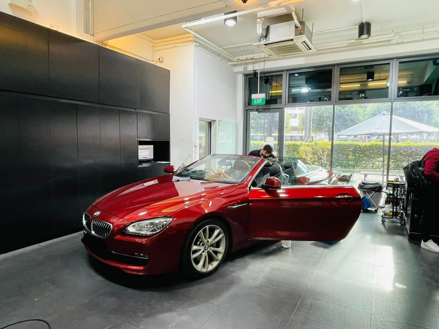Red BMW 6 Series convertible with top down at Infratint Singapore for window film