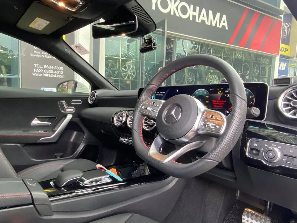 Mercedes-Benz AMG interior with steering wheel and digital cockpit at Infratint Singapore