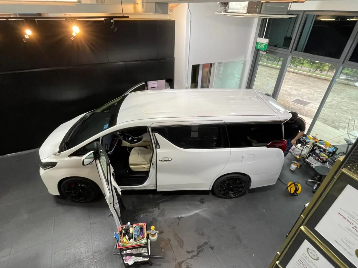 Overhead view of a white Toyota Alphard with sliding door open at Infratint Singapore