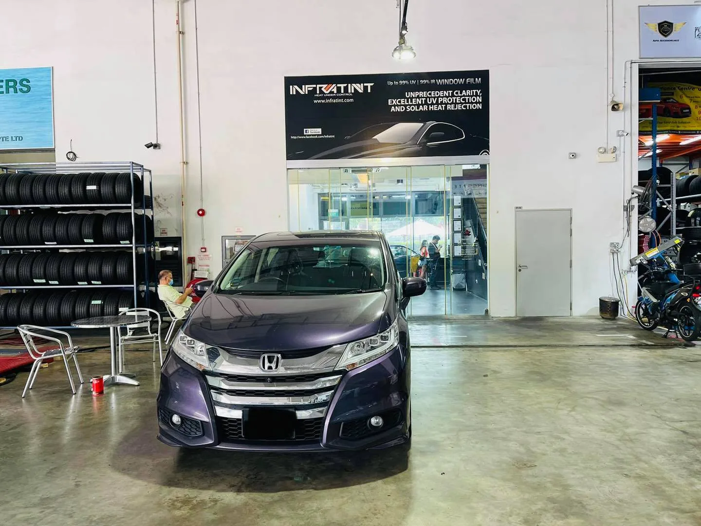 Grey Honda MPV getting window film fitted at Infratint Singapore