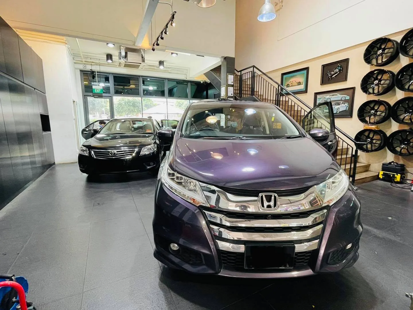 Dark purple Honda MPV during tinting at the Infratint Singapore showroom