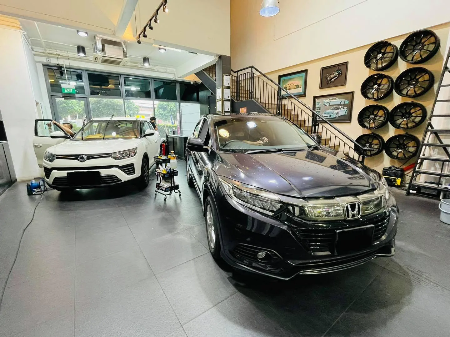Black Honda SUV and white SsangYong SUV at Infratint Singapore for window film