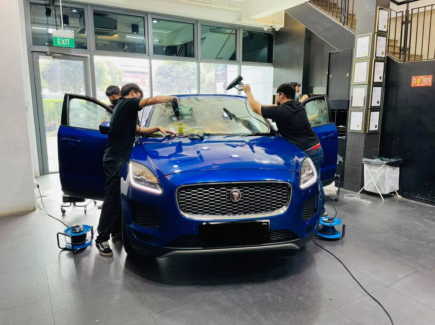 Blue Jaguar E-Pace SUV having its windscreen film installed at Infratint Singapore