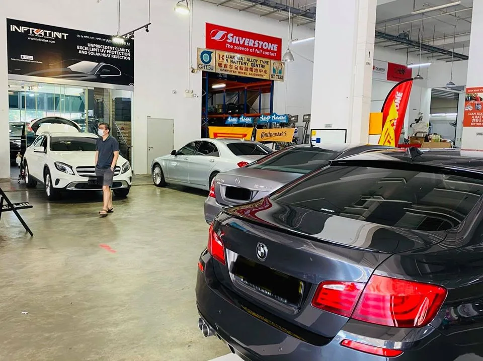 Grey BMW 5 Series with silver Mercedes and white Mercedes-Benz GLA SUV at Infratint Singapore