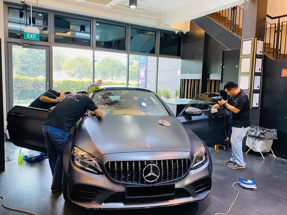 Matte grey Mercedes-Benz C-Class coupe during window tinting at Infratint Singapore