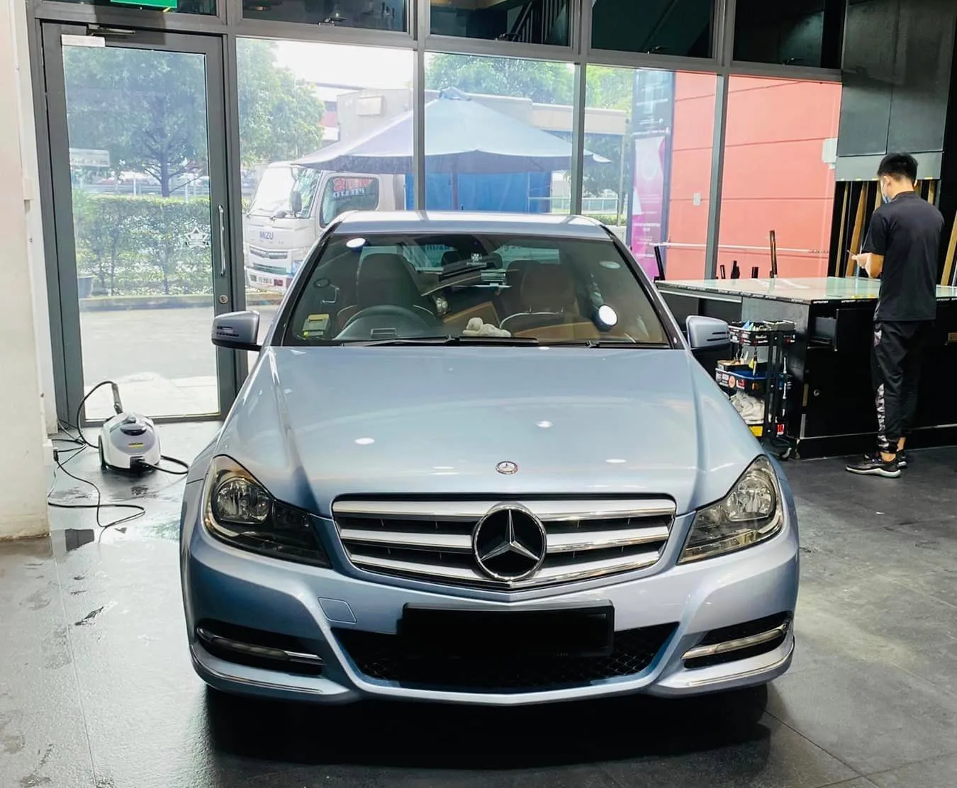 Light blue Mercedes-Benz C-Class in the install bay at Infratint Singapore