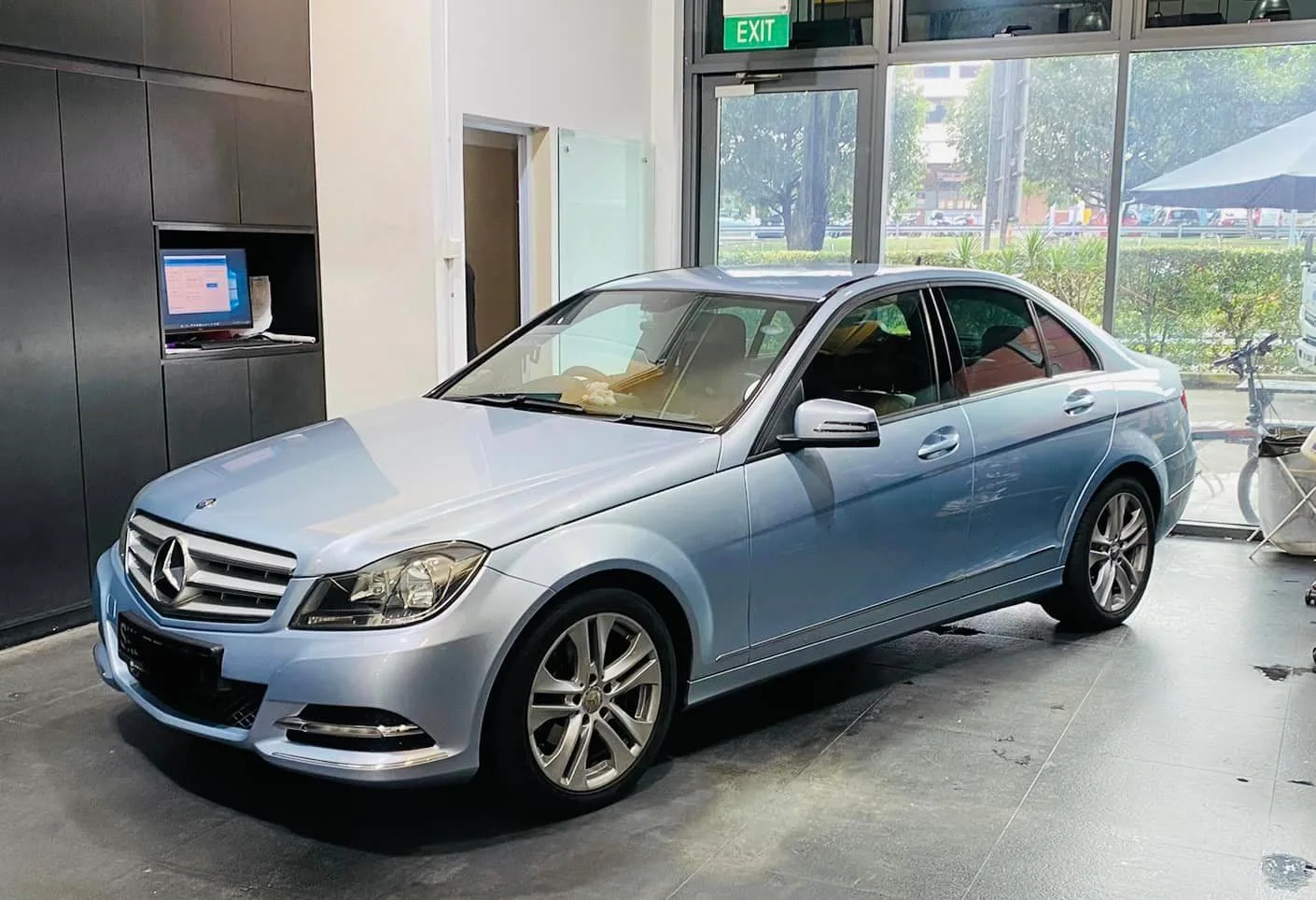 Light blue Mercedes-Benz C-Class parked inside the Infratint Singapore showroom