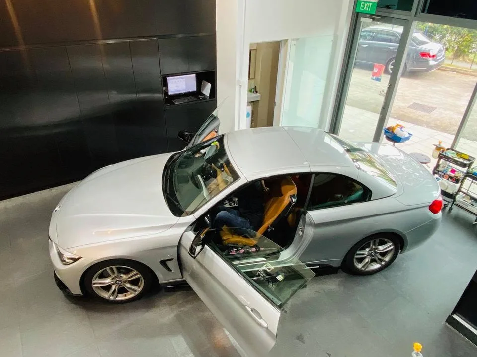 Silver BMW 4-Series convertible with tan interior at Infratint Singapore
