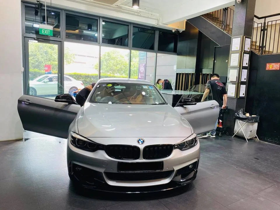 Silver BMW 4-Series with doors open before tinting at Infratint Singapore