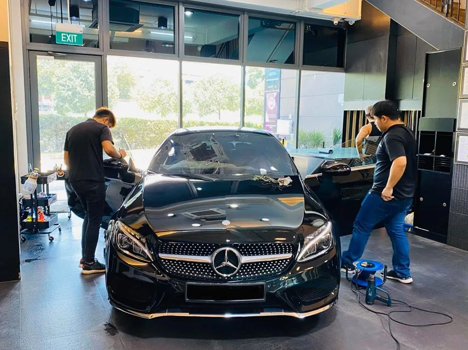 Black Mercedes-Benz coupe at the tinting station inside Infratint Singapore