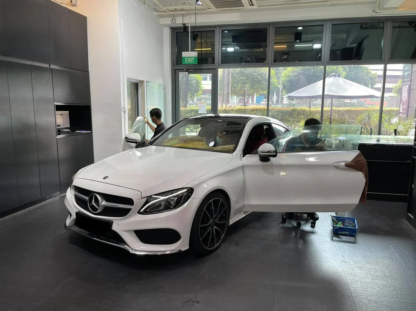 White Mercedes-Benz coupe with door open during window tinting at Infratint Singapore