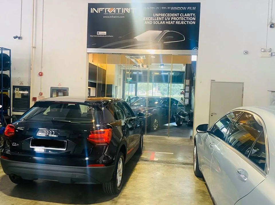 Black Audi Q2 and silver Mercedes-Benz sedan at Infratint Singapore