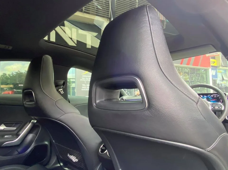 Interior front seats and panoramic roof of a Mercedes-Benz CLA at Infratint Singapore