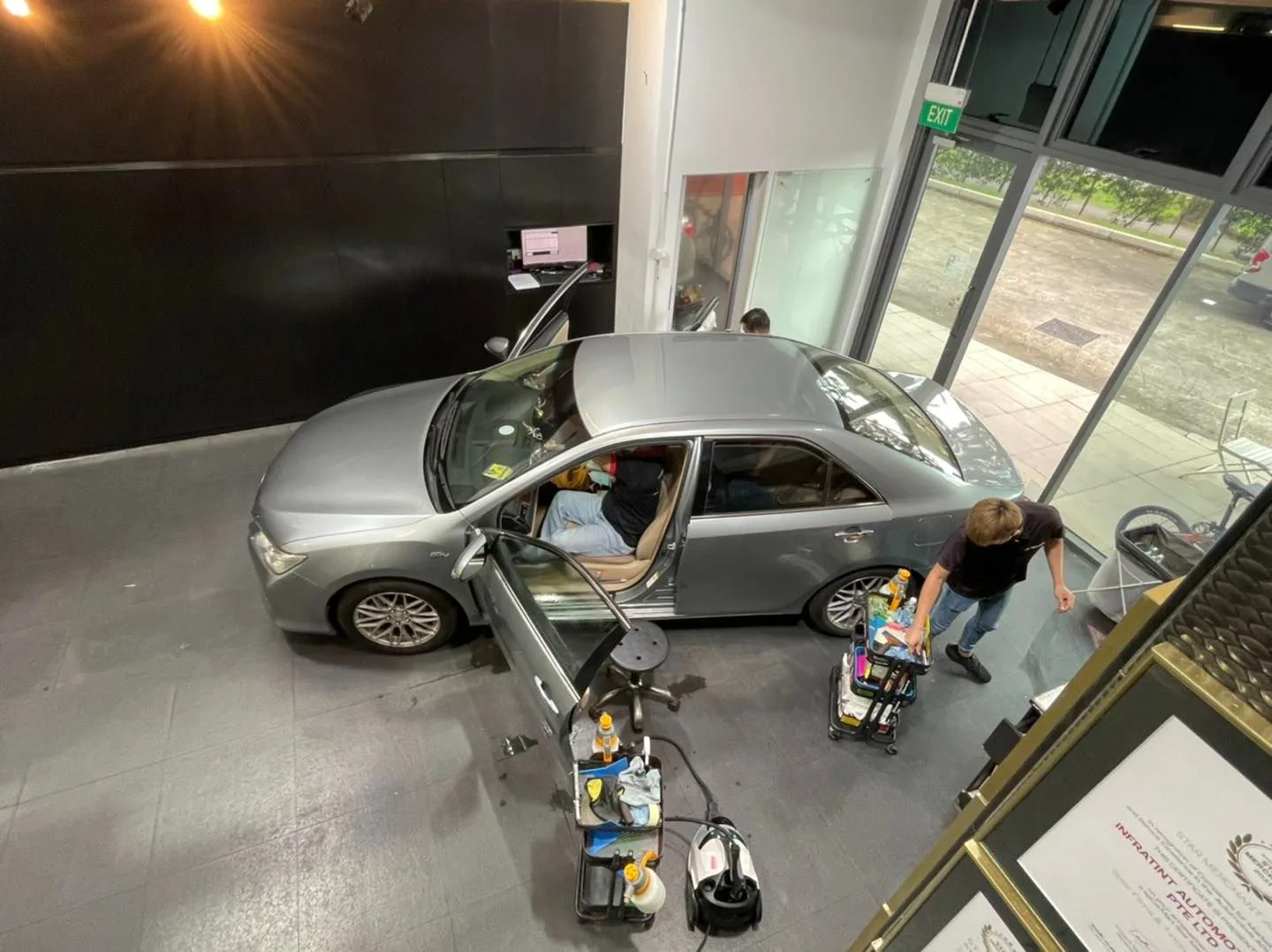Overhead view of a silver Toyota Camry being tinted at Infratint Singapore