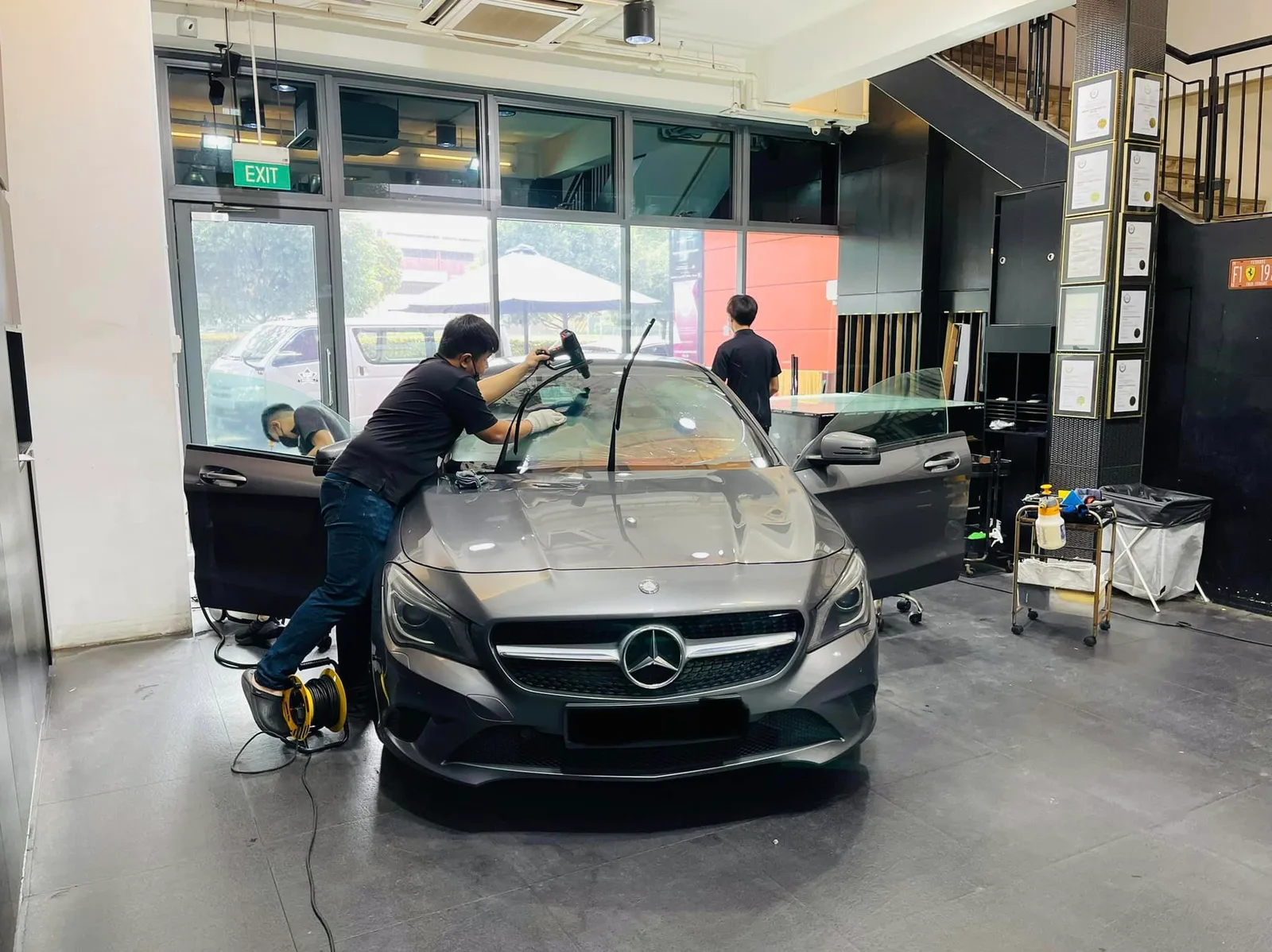 Grey Mercedes-Benz CLA having its windscreen tinted at Infratint Singapore