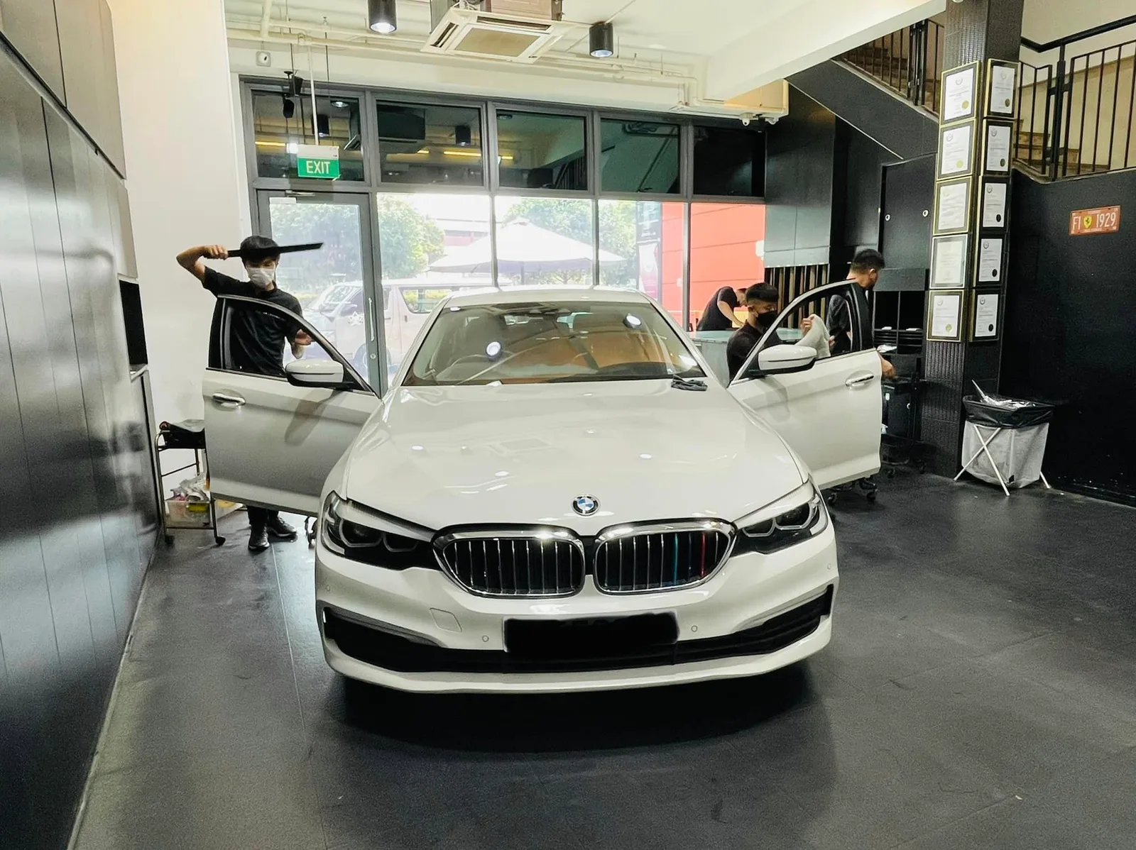 White BMW 5 Series sedan having windows tinted at Infratint Singapore