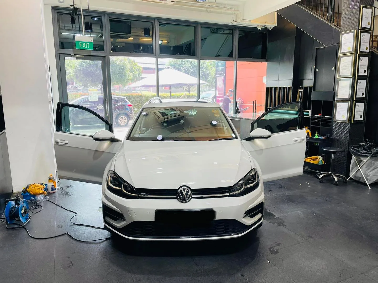 White Volkswagen Golf front view with doors open at Infratint Singapore