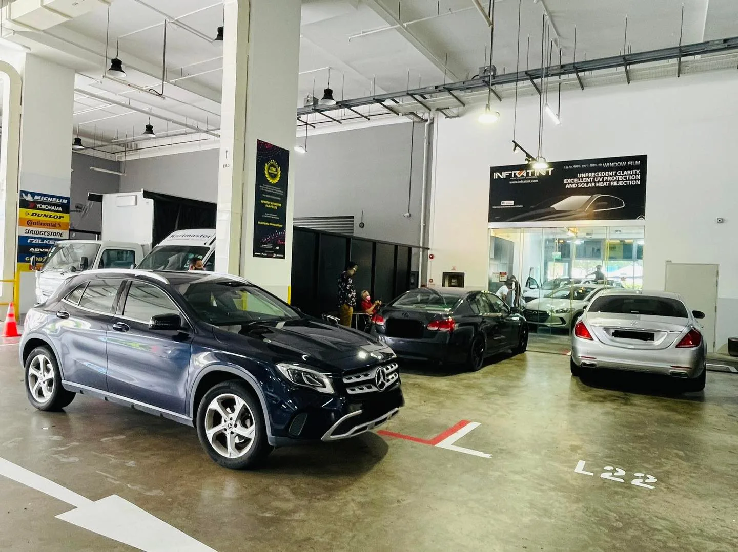 Dark blue Mercedes-Benz GLA SUV in the lineup at Infratint Singapore window tinting workshop