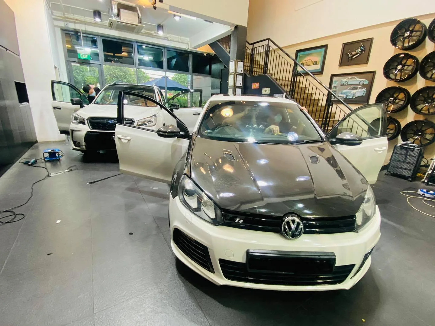 White Volkswagen Golf inside the Infratint Singapore showroom during window tinting