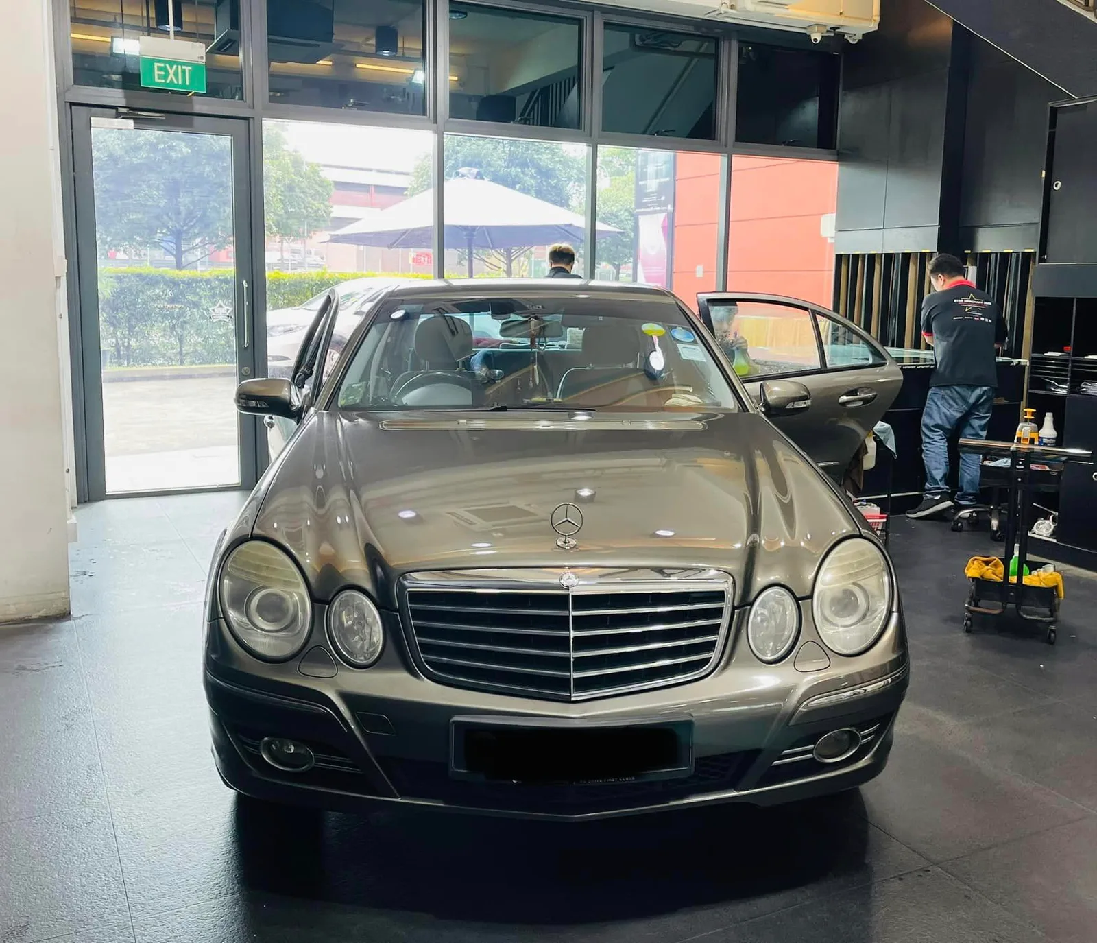 Bronze Mercedes-Benz E-Class sedan front view at Infratint Singapore