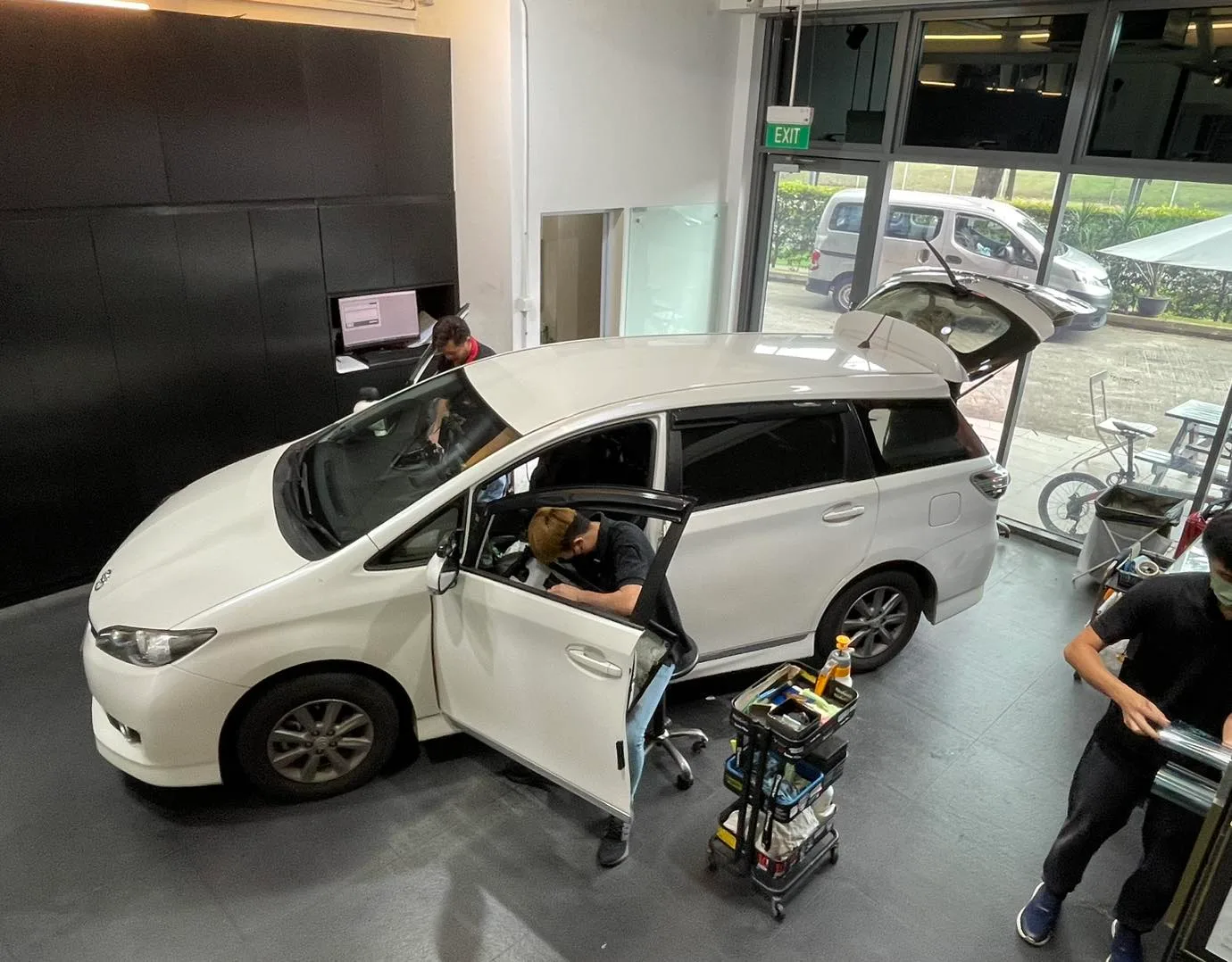 Overhead view of a white Toyota Wish being tinted at Infratint Singapore