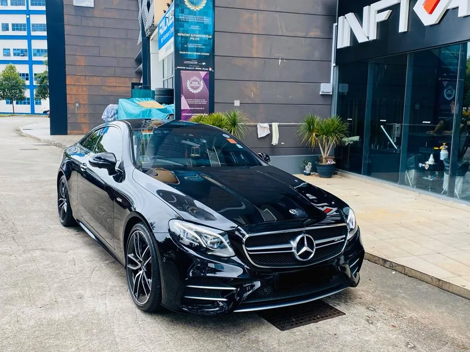 Black Mercedes-AMG E-Class coupe parked outside Infratint Singapore for window tinting
