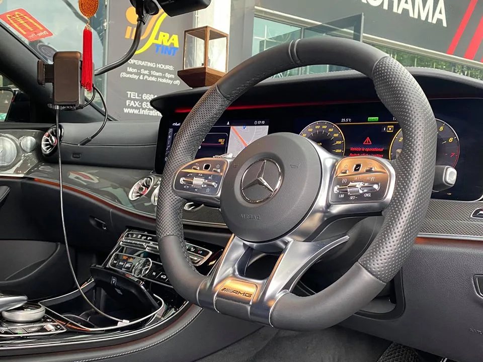 Mercedes-AMG steering wheel and digital cockpit interior viewed at Infratint Singapore