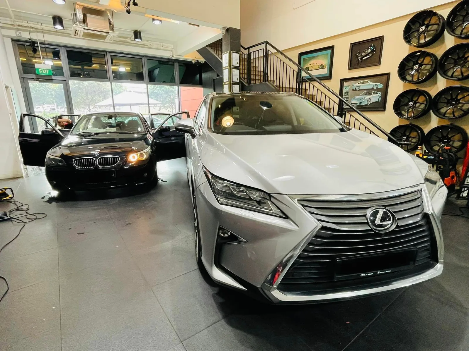 Silver Lexus RX and black BMW 5 Series inside the Infratint Singapore workshop