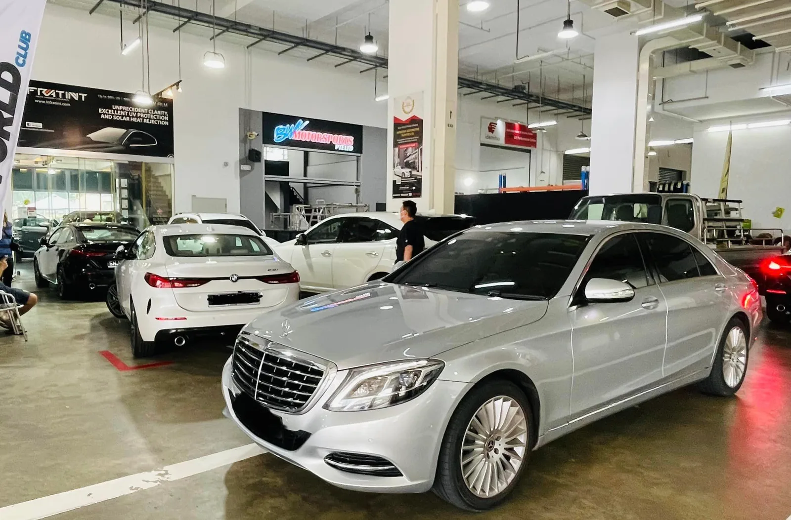 Silver Mercedes-Benz S-Class and grey BMW 4 Series at Infratint Singapore for window tinting