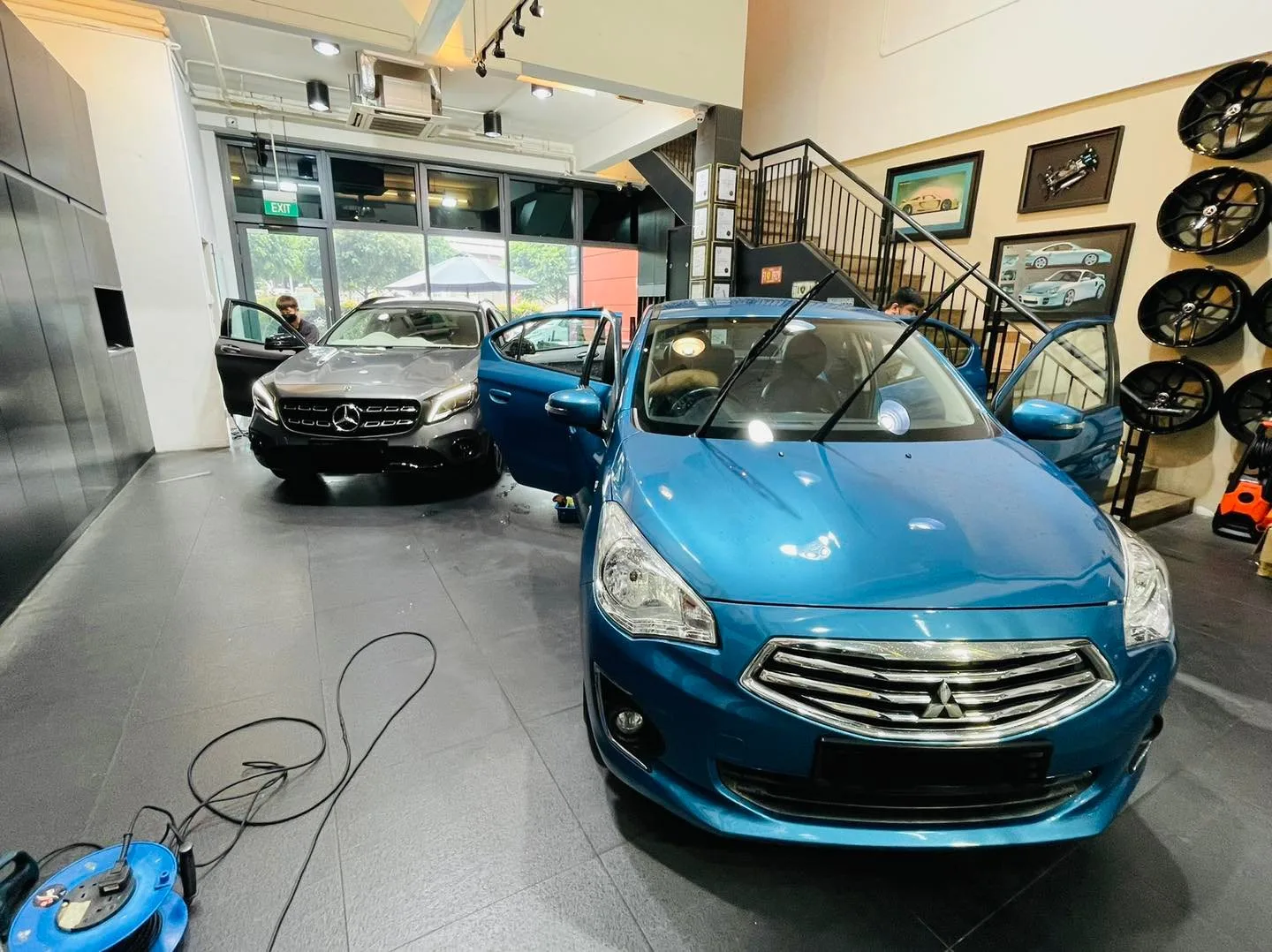 Blue Mitsubishi Attrage and grey Mercedes-Benz GLA at Infratint Singapore window tinting