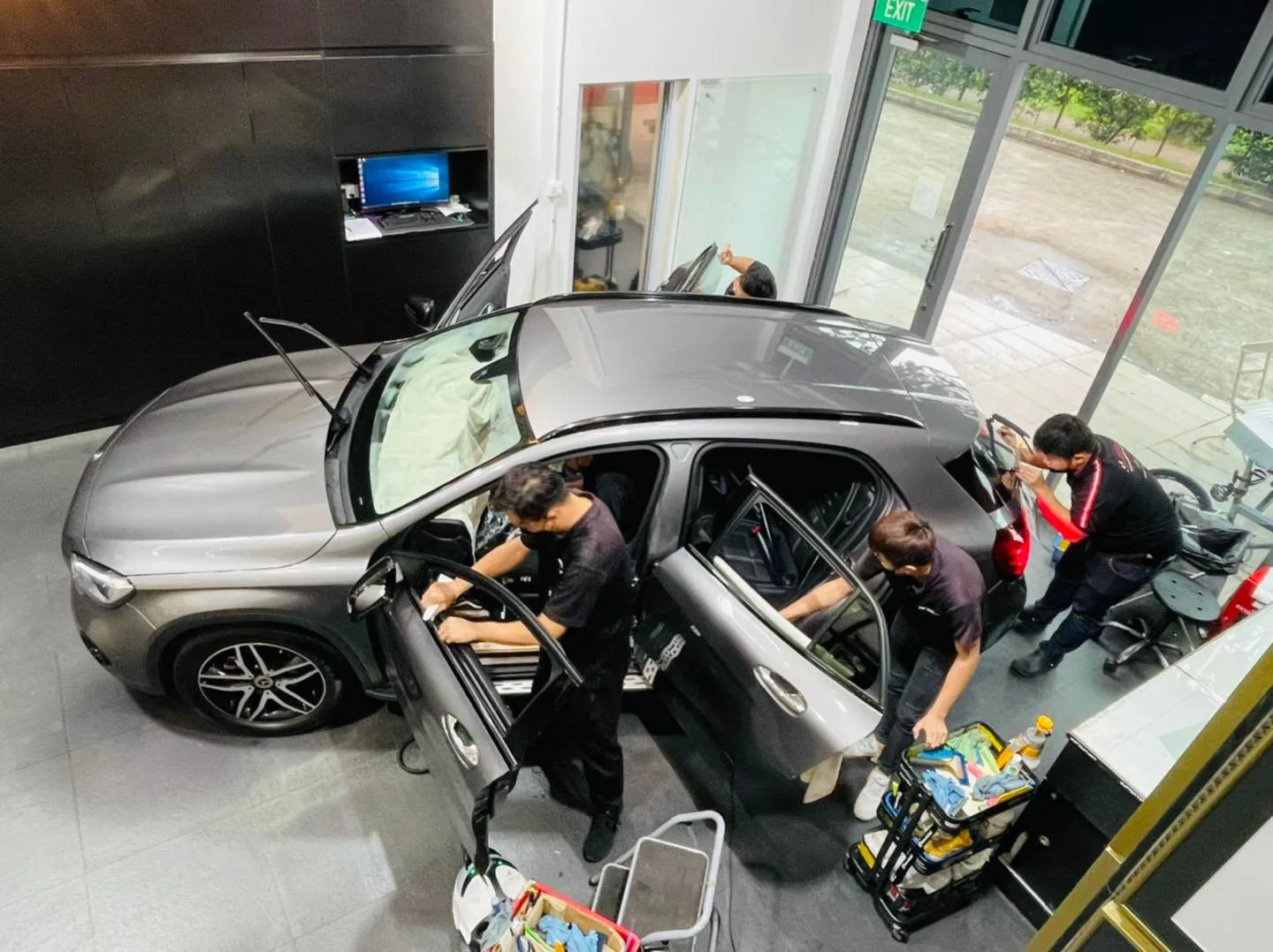 Overhead view of grey Mercedes-Benz GLA window tinting at Infratint Singapore