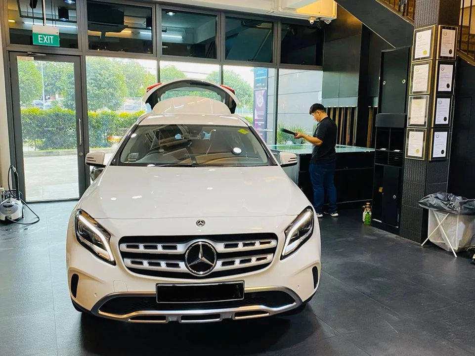 White Mercedes-Benz GLA with tailgate open during window tinting at Infratint Singapore