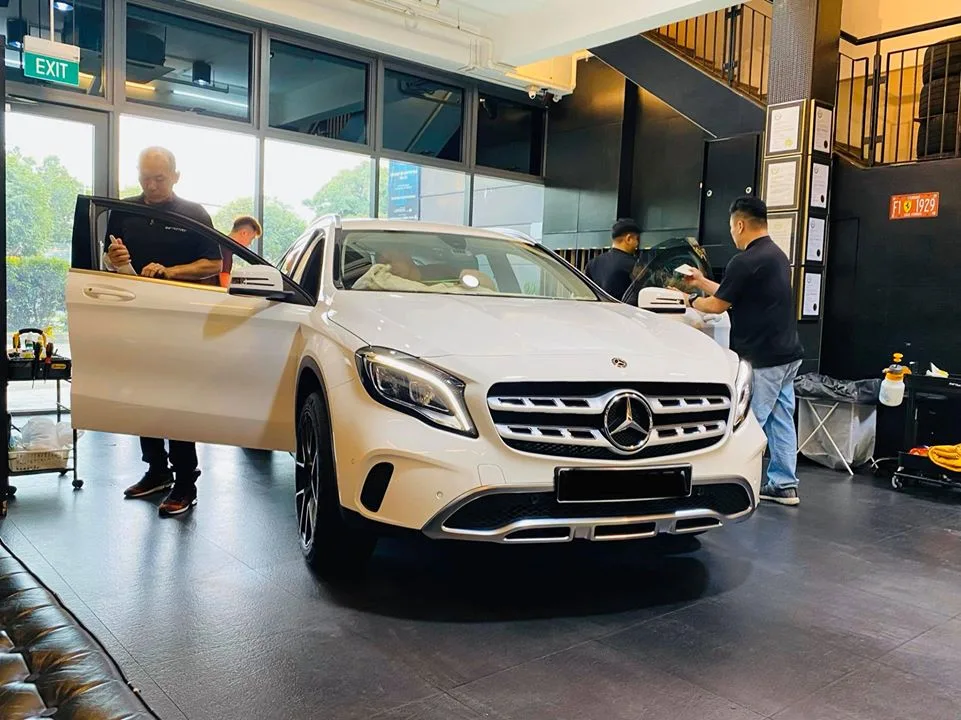 White Mercedes-Benz GLA front three-quarter with doors open at Infratint Singapore