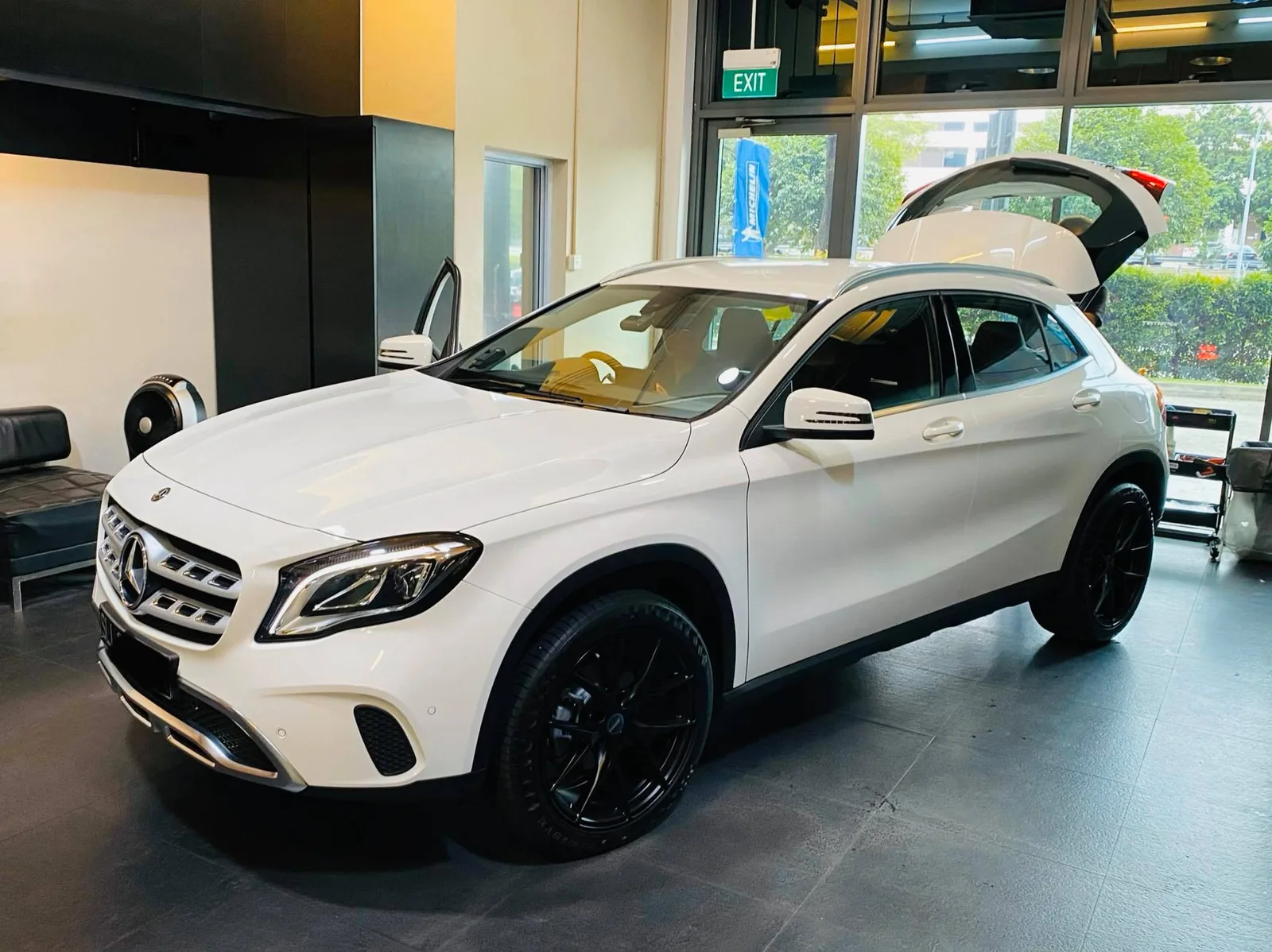 White Mercedes-Benz GLA crossover side three-quarter at Infratint Singapore