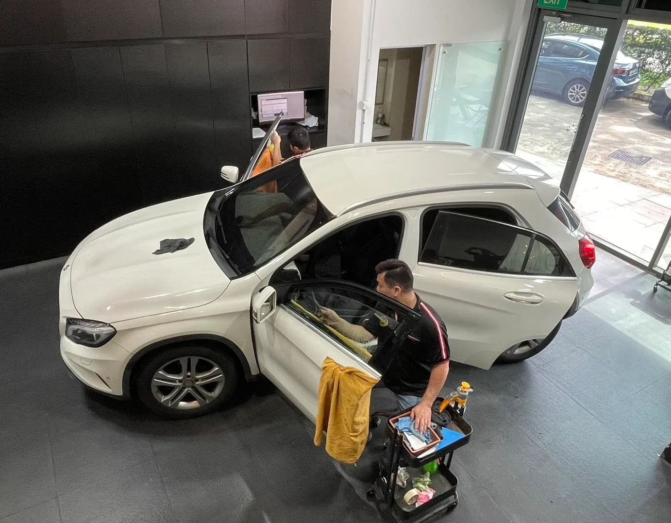 Overhead view of a white Mercedes-Benz GLA being tinted at Infratint Singapore